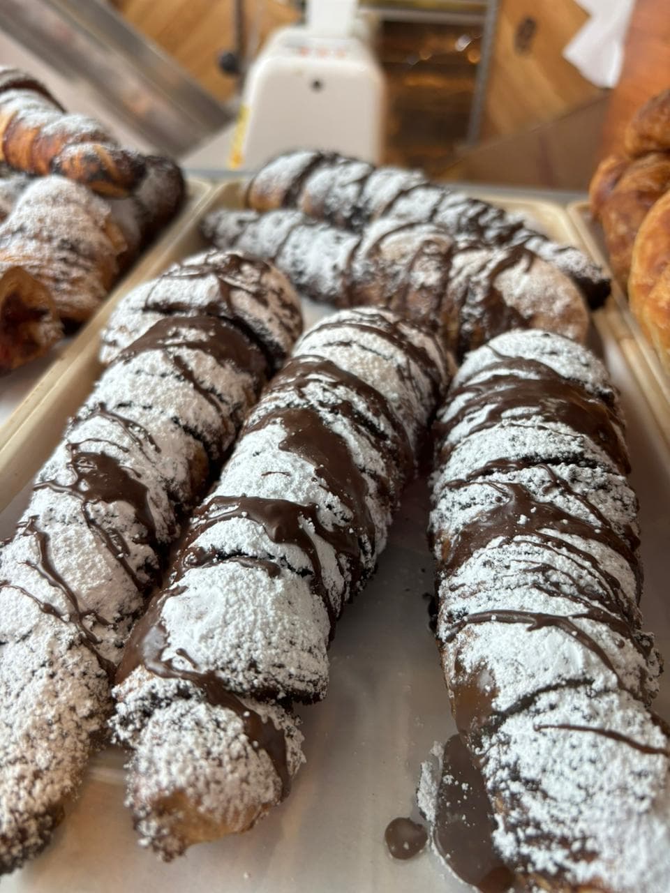 Powdered-sugar cream horn pastries