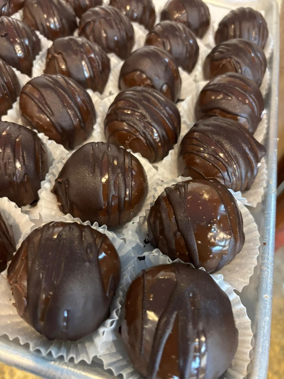 Chocolate-dipped cream-filled pastry shells