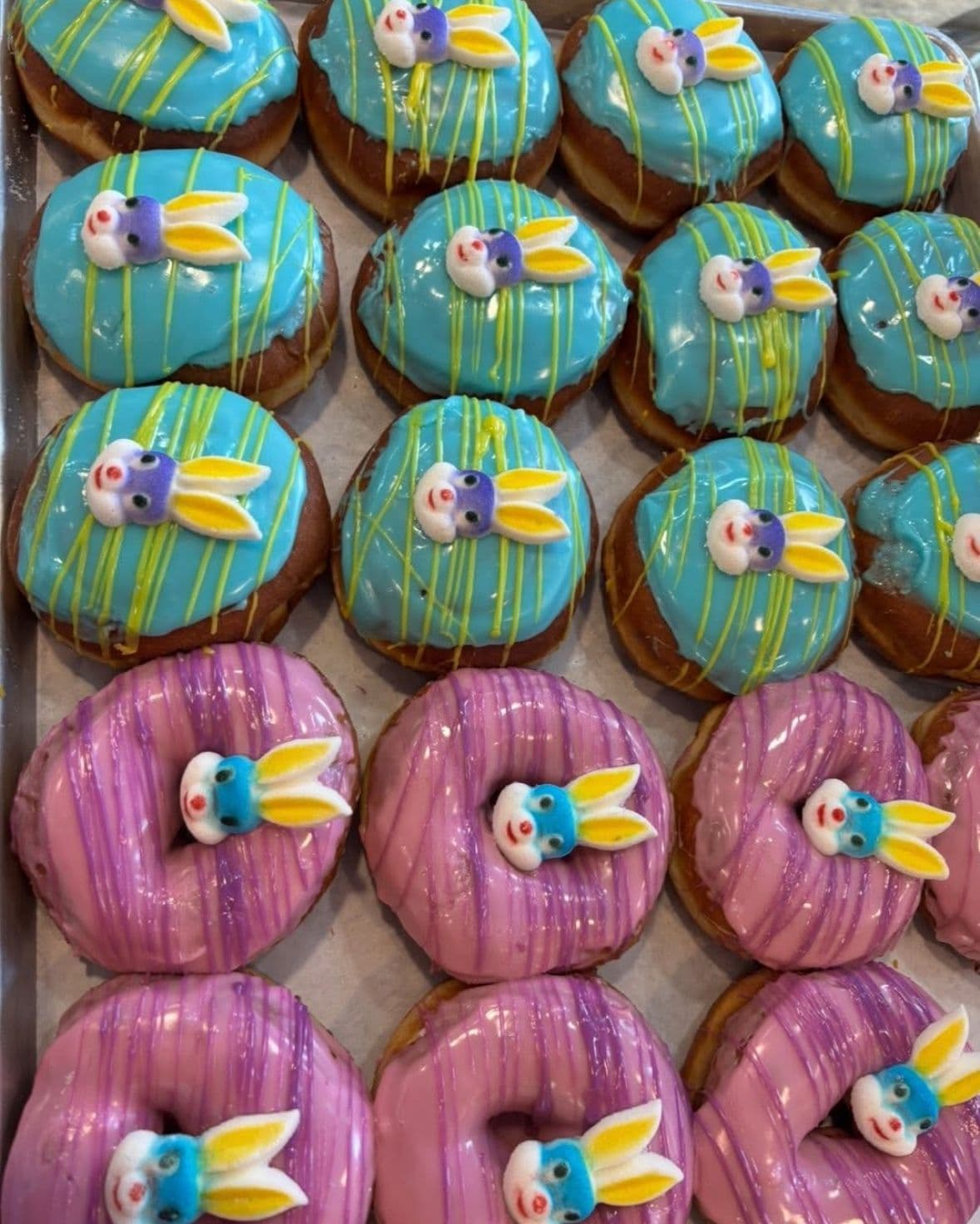 Turquoise and pink character-decorated donuts