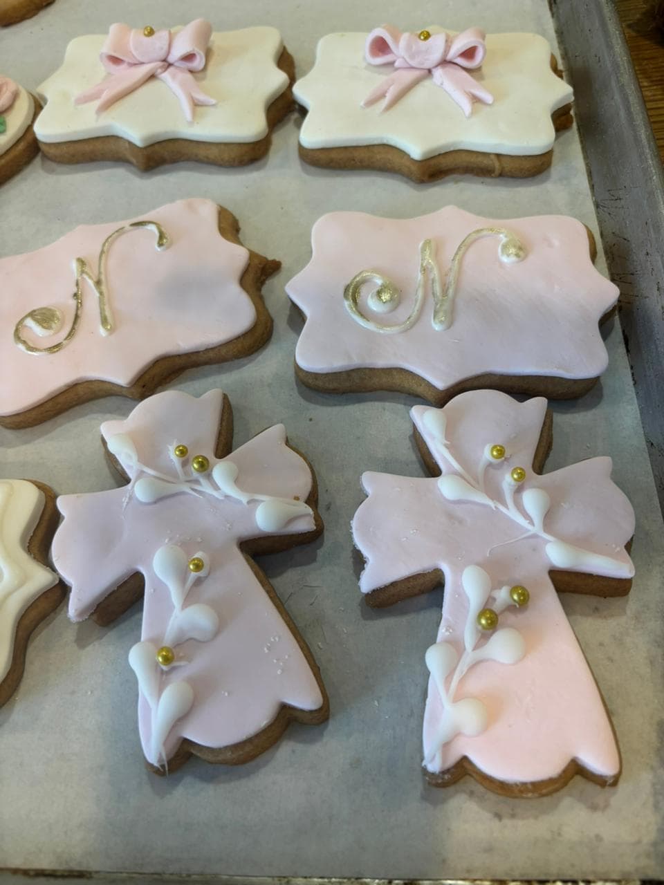 Decorated cross and bow communion cookies