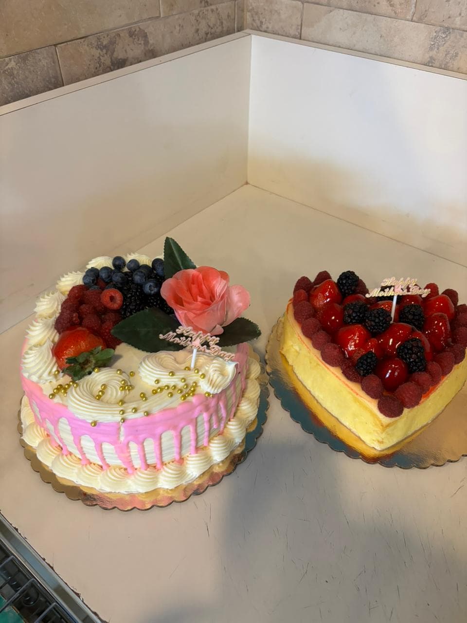 Two heart-shaped fruit and cream cakes