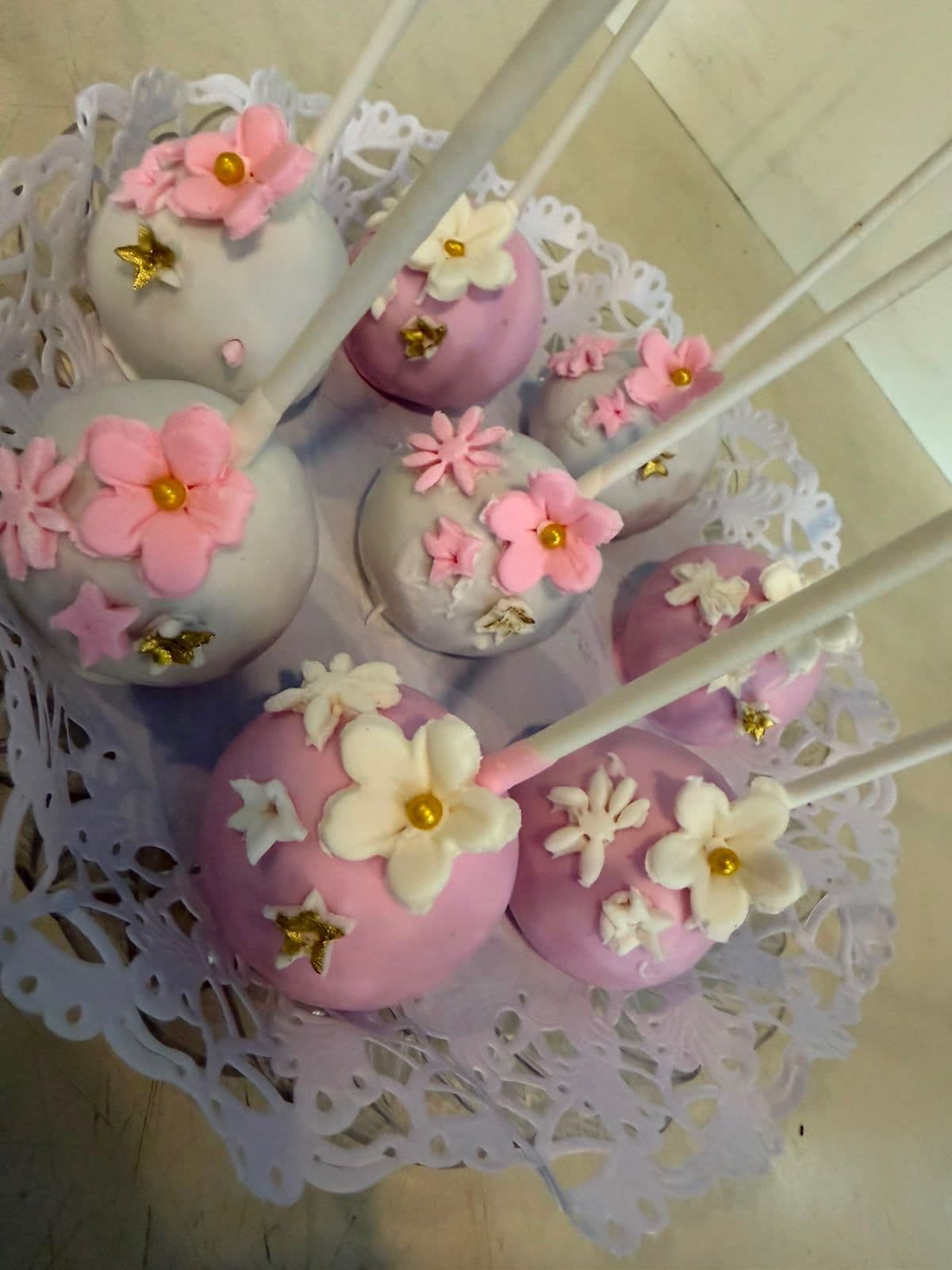 Flower-decorated pink and white cake pops
