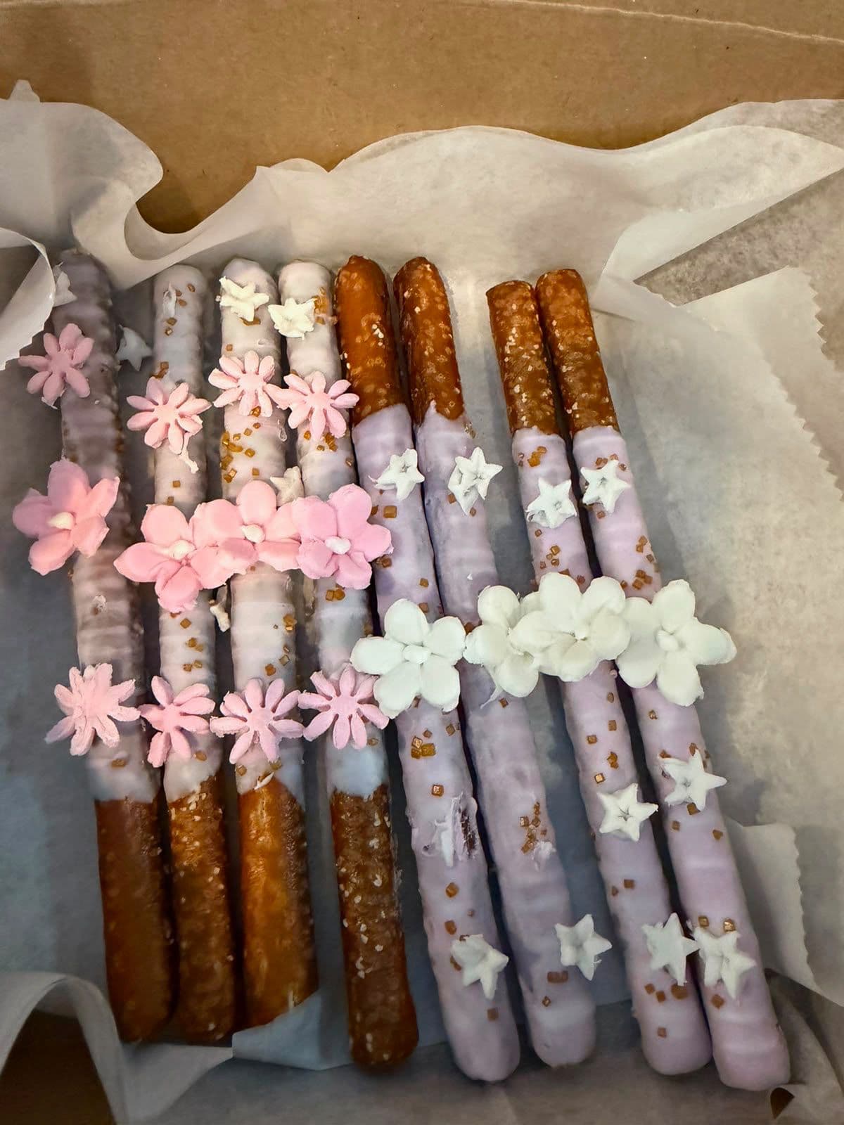 Chocolate-covered decorated pretzel rods