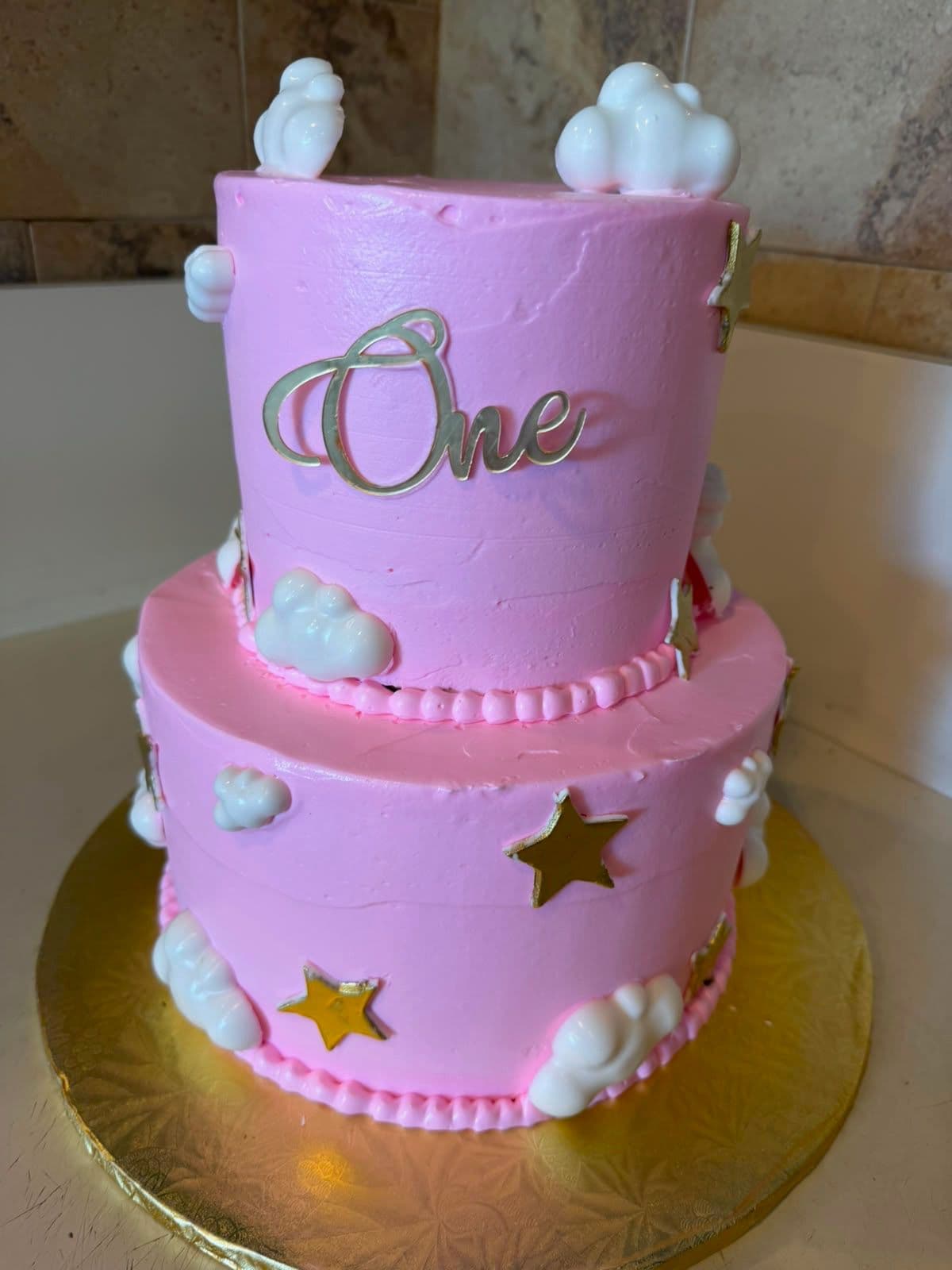 Pink two-tier first-birthday occasion cake